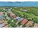 Riverwood community aerial view, featuring houses, golf course, and a pond at 3359 Osprey Ln, Port Charlotte, FL 33953
