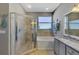 Bathroom with walk-in shower, garden tub, and double vanity at 3359 Osprey Ln, Port Charlotte, FL 33953
