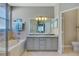 Bathroom boasts a double vanity, soaking tub, and separate shower at 3359 Osprey Ln, Port Charlotte, FL 33953