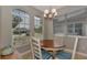 Bright breakfast nook features a round table and chairs, offering a view of the backyard at 3359 Osprey Ln, Port Charlotte, FL 33953