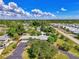 Aerial view of a single-Gathering home with a large yard and surrounding neighborhood at 797 Michigan Ave, Englewood, FL 34223