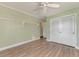 Bedroom with hardwood floors, built in shelving and double door closet at 797 Michigan Ave, Englewood, FL 34223