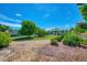Landscaped backyard featuring gravel pathways and tropical plants at 797 Michigan Ave, Englewood, FL 34223