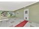 Spacious screened porch with tiled floor, offering a relaxing outdoor space at 797 Michigan Ave, Englewood, FL 34223