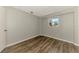 Spacious bedroom with wood-look floors and a window at 797 Michigan Ave, Englewood, FL 34223