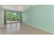 Living room featuring light walls and terrazzo flooring at 797 Michigan Ave, Englewood, FL 34223