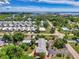 An aerial view of a house nestled in a quiet residential neighborhood at 797 Michigan Ave, Englewood, FL 34223