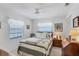Cozy bedroom with a ceiling fan and ample natural light at 504 Pine Hollow Cir # 504, Englewood, FL 34223