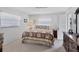 Spacious bedroom with a king-size bed and private access to a balcony at 504 Pine Hollow Cir # 504, Englewood, FL 34223