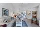 Living room with vaulted ceiling, comfy seating and view of dining area at 504 Pine Hollow Cir # 504, Englewood, FL 34223