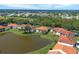Condos by the lake with a scenic townscape in the background at 504 Pine Hollow Cir # 504, Englewood, FL 34223