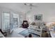 Bright living room with access to a balcony and water views at 504 Pine Hollow Cir # 504, Englewood, FL 34223