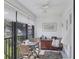 Enclosed patio with seating area and view of water at 504 Pine Hollow Cir # 504, Englewood, FL 34223
