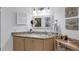 Granite-topped bathroom vanity with updated fixtures at 504 Pine Hollow Cir # 504, Englewood, FL 34223