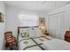 Bedroom with a ceiling fan and window coverings at 504 Pine Hollow Cir # 504, Englewood, FL 34223