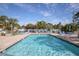 Refreshing community pool with ample seating for residents at 504 Pine Hollow Cir # 504, Englewood, FL 34223