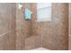 Large tiled shower with built-in seat at 8216 Parkside Dr, Englewood, FL 34224