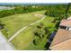 Aerial view showcasing the home's location near the golf course at 8216 Parkside Dr, Englewood, FL 34224