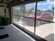 Garage with screen door and view of driveway at 8216 Parkside Dr, Englewood, FL 34224