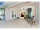 Spacious covered patio with access to the interior living space and outdoor seating at 8216 Parkside Dr, Englewood, FL 34224
