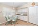 Bright kitchen with white cabinets, granite countertops, and a breakfast nook at 8216 Parkside Dr, Englewood, FL 34224