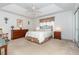 Spacious Primary bedroom with ample furniture and a ceiling fan at 8216 Parkside Dr, Englewood, FL 34224