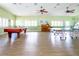 Community room features a pool table, ping pong, and a piano at 8216 Parkside Dr, Englewood, FL 34224