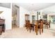 Formal dining room with large mirror and display cabinet at 8216 Parkside Dr, Englewood, FL 34224