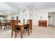 Dining room with wooden table, chairs, and mirror at 8216 Parkside Dr, Englewood, FL 34224