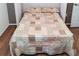 Bedroom with a queen-size bed and floral bedding at 8216 Parkside Dr, Englewood, FL 34224