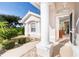 Front entrance with columns and view into living room at 8216 Parkside Dr, Englewood, FL 34224