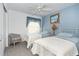 Bedroom with two twin beds and light blue decor at 8216 Parkside Dr, Englewood, FL 34224