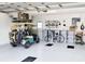 Spacious garage with golf cart, bicycle, and storage at 8216 Parkside Dr, Englewood, FL 34224