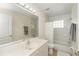 Clean bathroom with tub, shower, and vanity at 8216 Parkside Dr, Englewood, FL 34224