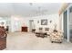Living room features sofa, armchair, and coffee table at 8216 Parkside Dr, Englewood, FL 34224