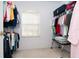 Spacious walk-in closet with ample hanging space at 8216 Parkside Dr, Englewood, FL 34224
