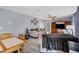 Bright and airy living room with hardwood floors, comfortable seating, and a view to the kitchen at 13401 Galveston Ave, Port Charlotte, FL 33981