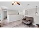 Upstairs landing with hardwood floors and a comfortable futon at 13401 Galveston Ave, Port Charlotte, FL 33981