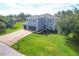 Two-story house with double garage and landscaped yard at 13401 Galveston Ave, Port Charlotte, FL 33981