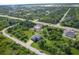 Aerial view of a house and surrounding area, showcasing its location and neighborhood at 13401 Galveston Ave, Port Charlotte, FL 33981