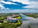 Waterfront building with lush landscaping and direct water access at 11100 Hacienda Del Mar Blvd # 202, Placida, FL 33946