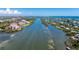 Waterfront condo building with serene water views and lush landscaping at 11100 Hacienda Del Mar Blvd # 202, Placida, FL 33946