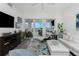 Spacious living room with water views and stylish furnishings at 11100 Hacienda Del Mar Blvd # 202, Placida, FL 33946
