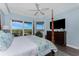 Main bedroom with a large TV and water views at 11100 Hacienda Del Mar Blvd # 202, Placida, FL 33946