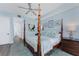Bright bedroom with a post bed and access to the bathroom at 11100 Hacienda Del Mar Blvd # 202, Placida, FL 33946