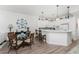 Modern kitchen with white cabinets and breakfast bar at 11100 Hacienda Del Mar Blvd # 202, Placida, FL 33946