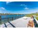 Wooden dock with benches and water views at 11100 Hacienda Del Mar Blvd # 202, Placida, FL 33946