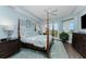 Main bedroom features a large bed, hardwood floors, and access to a balcony at 11100 Hacienda Del Mar Blvd # 202, Placida, FL 33946