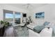 Living room with white sectional sofa and access to balcony at 11100 Hacienda Del Mar Blvd # 202, Placida, FL 33946