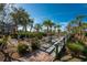 Landscaped walkway with wooden footbridge leading to waterfront at 11100 Hacienda Del Mar Blvd # 202, Placida, FL 33946